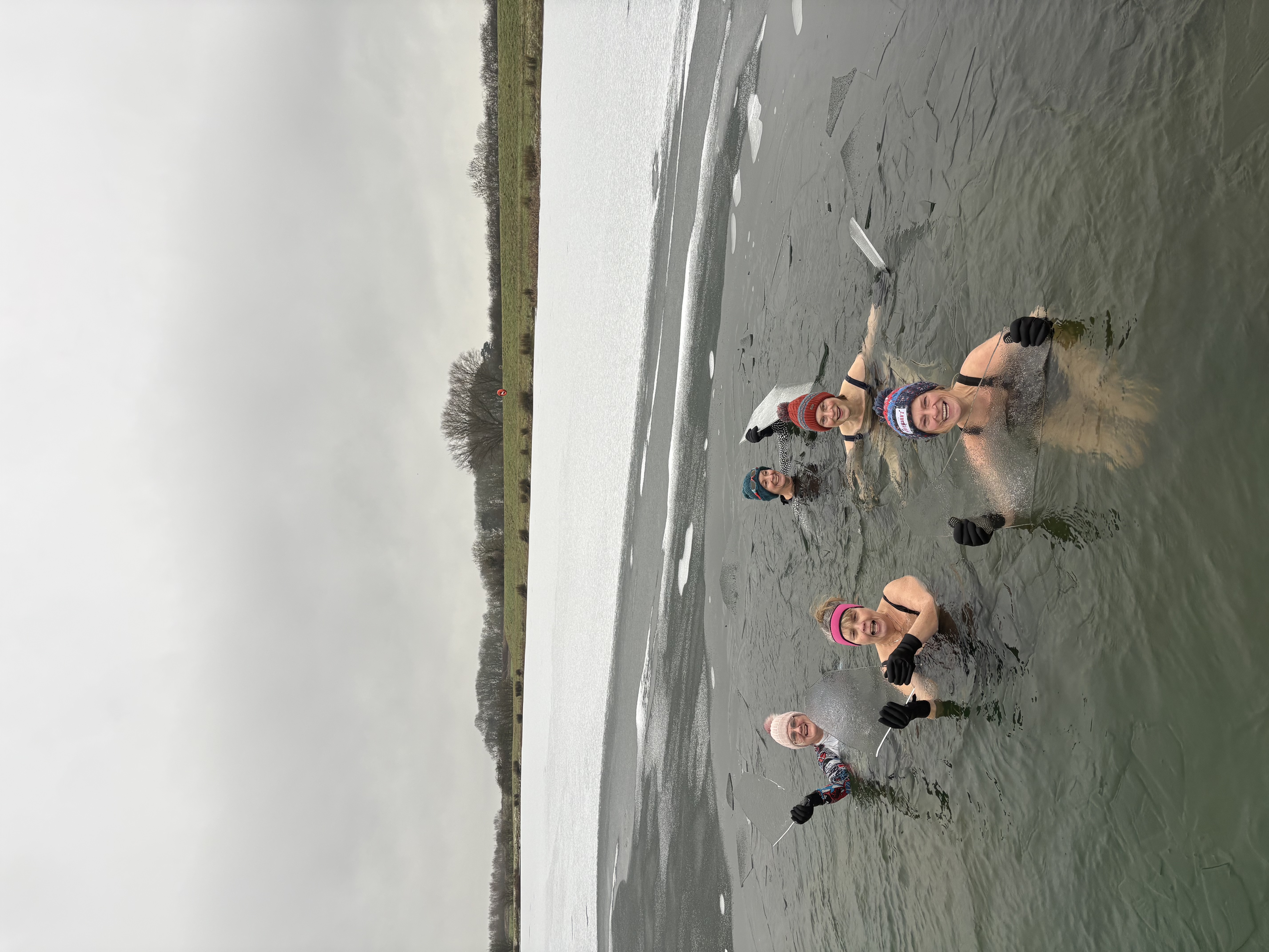Winter swimmers together in the reservoir